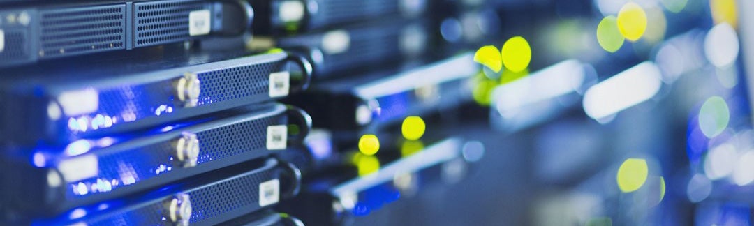 Blurred server racks with blue lights.
