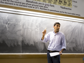 professor at chalkboard