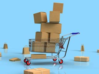 A shopping cart filled with boxes.